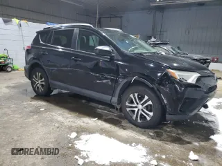 2017 Toyota RAV4 LE with VIN 2T3BFREV7HW601557, listed as a Copart auction lot 46050215 with 128,757 mi miles and Salvage Title. Bid and sale history available at DreamBid. Image 4.