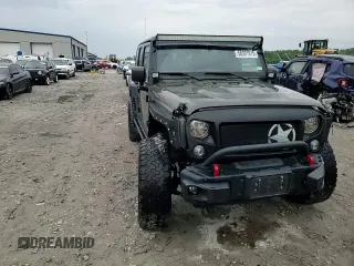 2015 Jeep Wrangler Unlimited Rubicon Hard Rock z VIN 1C4HJWFG8FL681796, wystawiony jako Copart lot #56391915 z przebiegiem 74 529 mil mil oraz Szkoda całkowita • Salvage title. Historia ofert i sprzedaży dostępna na DreamBid. Obrazek 13.