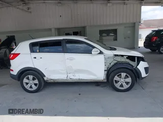 2013 Kia Sportage LX z VIN KNDPB3A2XD7521010, wystawiony jako IAAI lot #42297975 z przebiegiem 134 826 mil mil oraz . Historia ofert i sprzedaży dostępna na DreamBid. Obrazek 14.