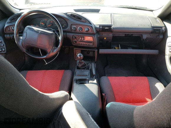 1994 Chevrolet Camaro z VIN 2G1FP22SXR2165249, wystawiony jako Copart lot #49333055 z przebiegiem 196 736 mil mil oraz Czysty tytuł • Clean title. Historia ofert i sprzedaży dostępna na DreamBid. Obrazek 8.