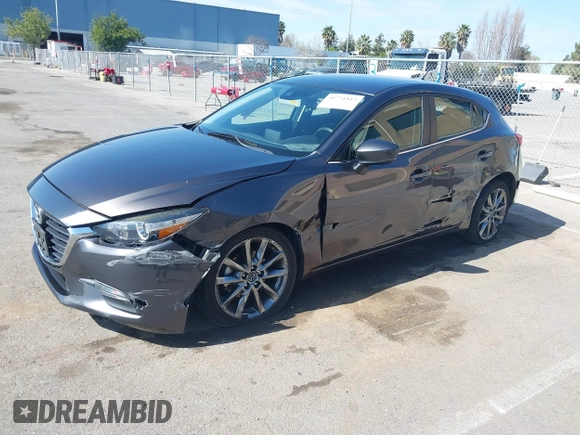 2018 Mazda 3 Touring z VIN 3MZBN1L38JM243749, wystawiony jako IAAI lot #41771812 z przebiegiem 65 533 mil mil oraz . Historia ofert i sprzedaży dostępna na DreamBid. Obrazek 17.