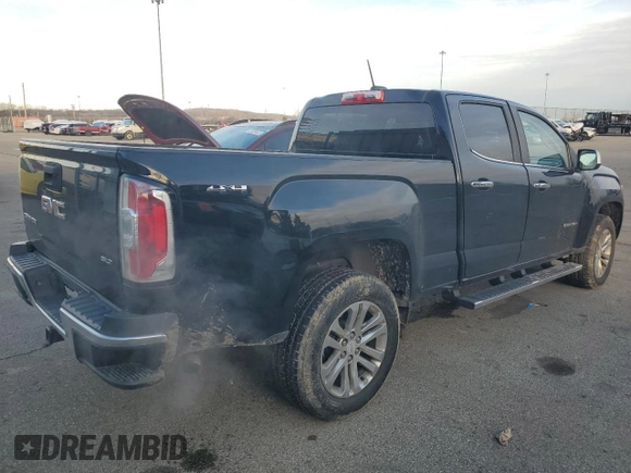 2015 GMC Canyon 4WD SLT z VIN 1GTG6CE34F1121540, wystawiony jako Copart lot #86190774 z przebiegiem 141 381 mil mil oraz Czysty tytuł • Clean title. Historia ofert i sprzedaży dostępna na DreamBid. Obrazek 3.