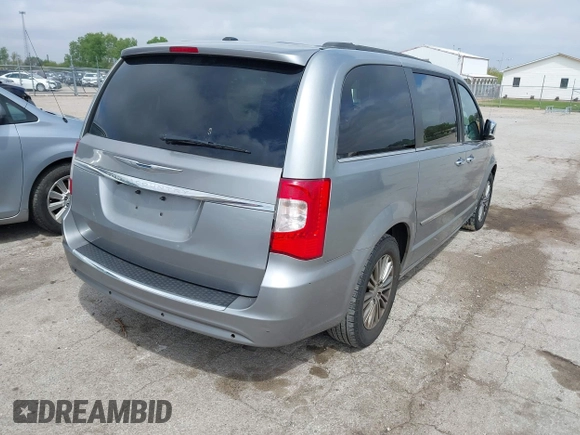 2014 Chrysler Town & Country Touring-L with VIN 2C4RC1CG2ER107917, listed as a IAAI auction lot 42180194 with 169,447 mi miles. Bid and sale history available at carsss.com. Image 4.