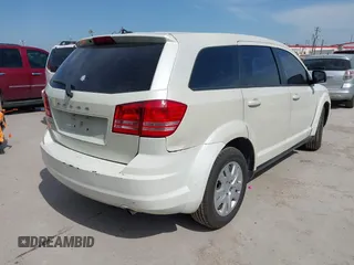 2013 Dodge Journey American Value with VIN 3C4PDCAB0DT723988, listed as a IAAI auction lot 42263191 with 205,014 mi miles and . Bid and sale history available at DreamBid. Image 4.