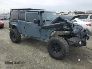 2015 Jeep Wrangler Unlimited Rubicon with VIN 1C4BJWFG7FL674201, listed as a Copart auction lot 49466455 with 0 mi miles and Salvage Title. Bid and sale history available at carsss.com. Image 4.