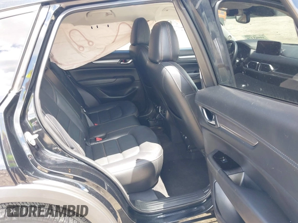 2023 Mazda CX-5 S Carbon Edition z VIN JM3KFBCMXP0201665, wystawiony jako IAAI lot #39965378 z przebiegiem 29 105 mil mil oraz . Historia ofert i sprzedaży dostępna na DreamBid. Obrazek 8.