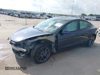 2023 Tesla Model 3 with VIN 5YJ3E1EA7PF567906, listed as a IAAI auction lot 42280993 with 41,452 mi miles and . Bid and sale history available at DreamBid. Image 2.