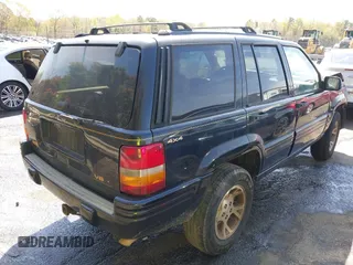 1997 Jeep Grand Cherokee Limited with VIN 1J4GZ78Y1VC658515, listed as a IAAI auction lot 41897266 with 164,033 mi miles and . Bid and sale history available at DreamBid. Image 4.