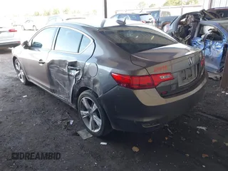 2014 Acura ILX Premium with VIN 19VDE1F51EE006621, listed as a IAAI auction lot 41984539 with 165,585 mi miles and . Bid and sale history available at DreamBid. Image 3.