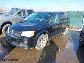 2014 Dodge Grand Caravan SXT with VIN 2C4RDGBG7ER197065, listed as a IAAI auction lot 41674441 with 233,065 mi miles. Bid and sale history available at carsss.com. Image 2.