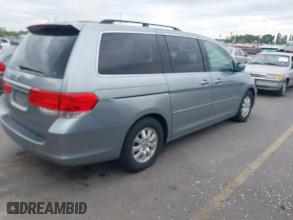 2009 Honda Odyssey EX-L with VIN 5FNRL38629B033203, listed as a IAAI auction lot 42172416 with 261,270 mi miles. Bid and sale history available at carsss.com. Image 4.