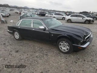 2003 Jaguar XJ Vanden Plas with VIN SAJDA24C33LF52131, listed as a Copart auction lot 84263554 with Not provided miles and Clean title. Bid and sale history available at DreamBid. Image 4.