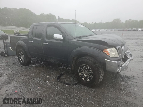 2010 Nissan Frontier SE with VIN 1N6AD0EV5AC407533, listed as a Copart auction lot 52020365 with 119,041 mi miles and Salvage title. Bid and sale history available at DreamBid. Image 4.