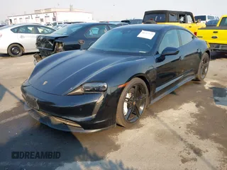 2022 Porsche Taycan z VIN WP0AA2Y10NSA11640, wystawiony jako IAAI lot #41215410 z przebiegiem 25 749 mil mil oraz . Historia ofert i sprzedaży dostępna na DreamBid. Obrazek 2.
