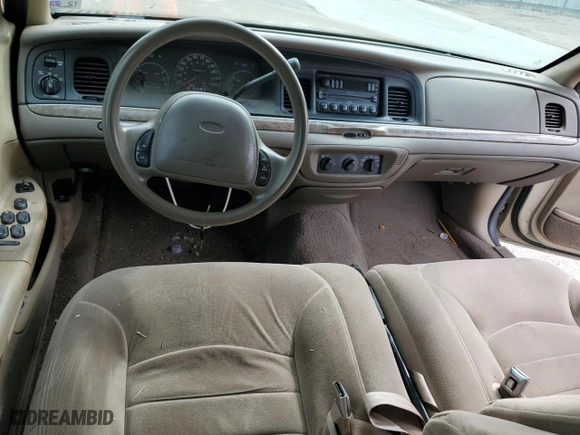 2000 Ford Crown Victoria LX with VIN 2FAFP74W7YX117705, listed as a Copart auction lot 79226944 with 128,019 mi miles and Salvage Title. Bid and sale history available at carsss.com. Image 8.