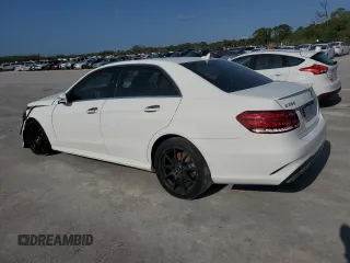 2014 Mercedes-Benz E 350 Sport with VIN WDDHF5KB5EA967675, listed as a Copart auction lot 52763995 with 68,902 mi miles and Salvage title. Bid and sale history available at DreamBid. Image 2.