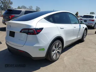 2023 Tesla Model Y Long Range z VIN 7SAYGDEE5PA104635, wystawiony jako IAAI lot #41989014 z przebiegiem 15 347 mil mil oraz . Historia ofert i sprzedaży dostępna na DreamBid. Obrazek 4.