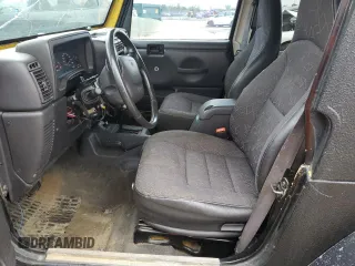 2002 Jeep Wrangler Sport z VIN 1J4FA49S22P763189, wystawiony jako Copart lot #57650295 z przebiegiem 197 383 mil mil oraz Czysty tytuł • Clean title. Historia ofert i sprzedaży dostępna na DreamBid. Obrazek 7.