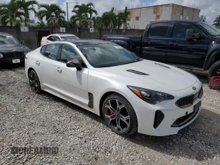 2021 Kia Stinger GT1 with VIN KNAE45LC9M6090262, listed as a Copart auction lot 77339854 with 3,354 mi miles and Salvage Title. Bid and sale history available at carsss.com. Image 4.