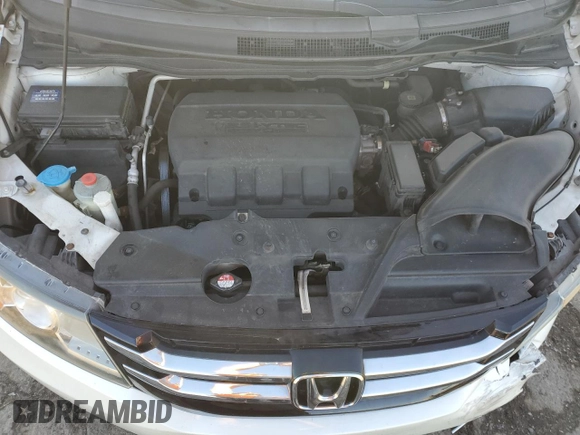 2014 Honda Odyssey EX-L with VIN 5FNRL5H61EB005740, listed as a Copart auction lot 54663595 with 118,971 mi miles and Salvage Title. Bid and sale history available at DreamBid. Image 12.