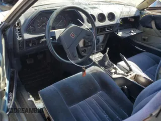 1979 Datsun 280ZX z VIN HS130123182, wystawiony jako Copart lot #61076424 z przebiegiem 48 711 mil mil oraz Szkody całkowita. Historia ofert i sprzedaży dostępna na DreamBid. Obrazek 8.