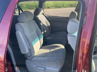 1999 Toyota Sienna LE with VIN 4T3ZF13C5XU141279, listed as a Copart auction lot 64366315 with 218,223 mi miles and Clean title. Bid and sale history available at DreamBid. Image 6.