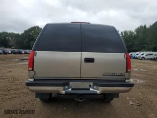 1999 Chevrolet Suburban with VIN 1GNGK26J0XJ439859, listed as a Copart auction lot 69076004 with 277,201 mi miles and Salvage Title. Bid and sale history available at carsss.com. Image 6.