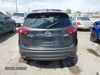 2016 Mazda CX-5 Grand Touring with VIN JM3KE4DY7G0643643, listed as a IAAI auction lot 42077497 with 120,343 mi miles and . Bid and sale history available at carsss.com. Image 16.