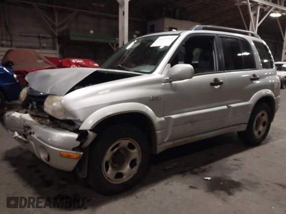 2002 Suzuki Grand Vitara JLX z VIN JS3TD62V324161291, wystawiony jako IAAI lot #41577344 z przebiegiem 164 658 mil mil oraz . Historia ofert i sprzedaży dostępna na DreamBid. Obrazek 17.