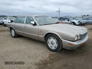 1997 Jaguar XJ Vanden Plas with VIN SAJKX6245VC800386, listed as a Copart auction lot 53651675 with 158,185 mi miles and Salvage Title. Bid and sale history available at DreamBid. Image 4.