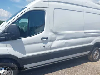 2023 Ford Transit Cargo with VIN 1FTBR2X81PKB38408, listed as a IAAI auction lot 42608271 with 28,384 mi miles and . Bid and sale history available at DreamBid. Image 6.
