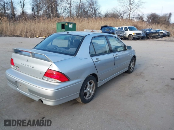 2003 Mitsubishi Lancer OZ-Rally with VIN JA3AJ86E63U022390, listed as a IAAI auction lot 41542407 with 184,639 mi miles. Bid and sale history available at carsss.com. Image 4.