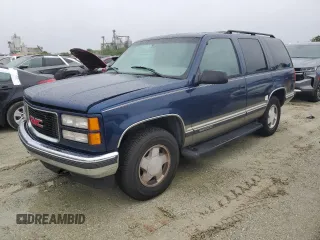 1999 GMC Yukon with VIN 1GKEK13R2XJ739931, listed as a Copart auction lot 74583734 with 115,605 mi miles and Salvage Title. Bid and sale history available at carsss.com. Image 1.
