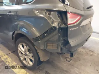 2016 Ford Escape Titanium with VIN 1FMCU9J92GUB63525, listed as a IAAI auction lot 41469824 with 156,773 mi miles. Bid and sale history available at carsss.com. Image 21.