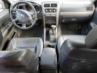 2004 Nissan Frontier LE z VIN 1N6ED27T14C460890, wystawiony jako Copart lot #55610435 z przebiegiem 218 988 mil mil oraz Szkody całkowita. Historia ofert i sprzedaży dostępna na DreamBid. Obrazek 8.