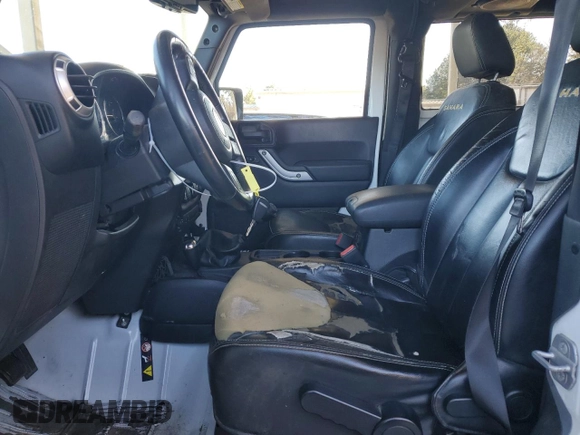 2014 Jeep Wrangler Sahara with VIN 1C4AJWBG1EL168007, listed as a Copart auction lot 87331394 with 113,228 mi miles and Salvage Title. Bid and sale history available at DreamBid. Image 7.