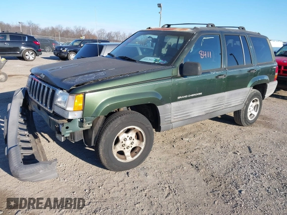 1997 Jeep Grand Cherokee Laredo with VIN 1J4GZ58SXVC687950, listed as a IAAI auction lot 40978411 with 176,514 mi miles. Bid and sale history available at carsss.com. Image 2.