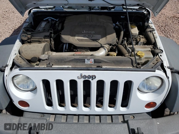 2012 Jeep Wrangler Sport с VIN 1C4AJWAG0CL219303, выставлен на аукционе Copart как лот 55102115 с пробегом 104 003 миль миль и Списание • Salvage title. История ставок и продаж доступна на DreamBid. Изображение 12.