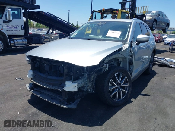 2018 Mazda CX-5 Grand Touring with VIN JM3KFBDM3J0343782, listed as a IAAI auction lot 42527044 with 60,180 mi miles and . Bid and sale history available at DreamBid. Image 6.