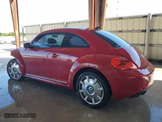 2012 Volkswagen Beetle 2.5L with VIN 3VWJX7AT7CM662822, listed as a Copart auction lot 74215804 with 115,890 mi miles and Salvage Title. Bid and sale history available at carsss.com. Image 2.