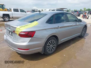 2021 Volkswagen Jetta S z VIN 3VWC57BU4MM094780, wystawiony jako IAAI lot #42103554 z przebiegiem 49 044 mil mil oraz . Historia ofert i sprzedaży dostępna na DreamBid. Obrazek 4.