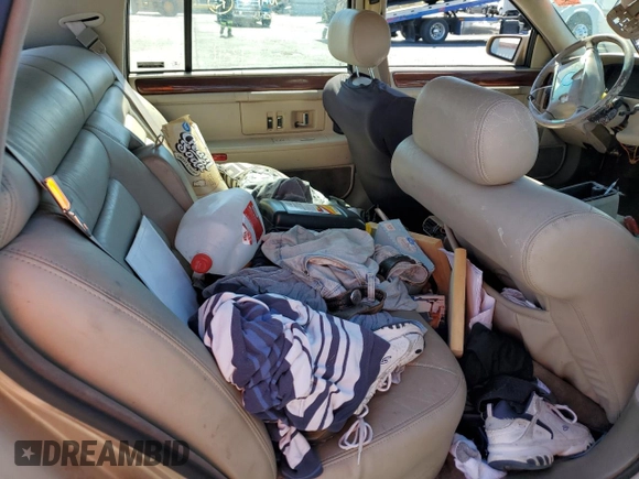 1995 Cadillac DeVille z VIN 1G6KD52B6SU274827, wystawiony jako Copart lot #41902125 z przebiegiem Nie podano mil oraz Szkoda całkowita • Salvage title. Historia ofert i sprzedaży dostępna na DreamBid. Obrazek 11.