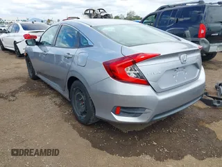 2018 Honda Civic LX with VIN 2HGFC2F50JH500559, listed as a IAAI auction lot 42040271 with 82,026 mi miles and . Bid and sale history available at DreamBid. Image 3.