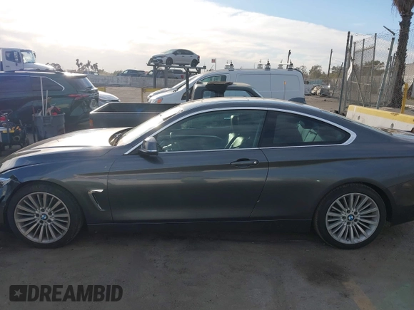 2014 BMW 4 Series 428i with VIN WBA3N7C5XEF719384, listed as a IAAI auction lot 41694678 with 115,517 mi miles and . Bid and sale history available at carsss.com. Image 14.