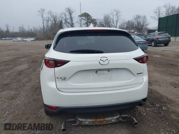 2021 Mazda CX-5 Touring with VIN JM3KFBCM1M1446313, listed as a IAAI auction lot 41930330 with 28,610 mi miles. Bid and sale history available at carsss.com. Image 16.