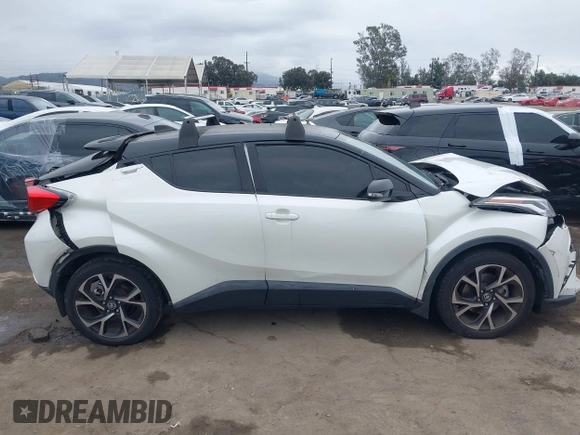 2020 Toyota C-HR LE with VIN JTNKHMBX9L1092934, listed as a IAAI auction lot 42021972 with 56,777 mi miles and . Bid and sale history available at DreamBid. Image 13.