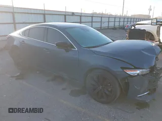 2021 Mazda 6 Carbon Edition with VIN JM1GL1WY9M1619981, listed as a IAAI auction lot 41751194 with 32,083 mi miles and . Bid and sale history available at DreamBid. Image 1.