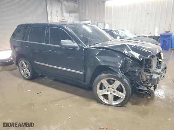 2007 Jeep Grand Cherokee SRT-8 with VIN 1J8HR78377C512937, listed as a Copart auction lot 83219784 with 158,485 mi miles and Salvage Title. Bid and sale history available at carsss.com. Image 4.