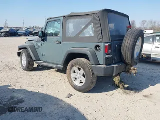 2014 Jeep Wrangler Sport with VIN 1C4AJWAG5EL271318, listed as a IAAI auction lot 41780040 with 128,942 mi miles and . Bid and sale history available at DreamBid. Image 3.