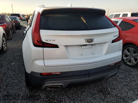 2020 Cadillac XT4 FWD Premium Luxury z VIN 1GYFZCR49LF118146, wystawiony jako Copart lot #82495614 z przebiegiem Nie podano mil oraz Nie do naprawy • Non repairable. Historia ofert i sprzedaży dostępna na DreamBid. Obrazek 6.